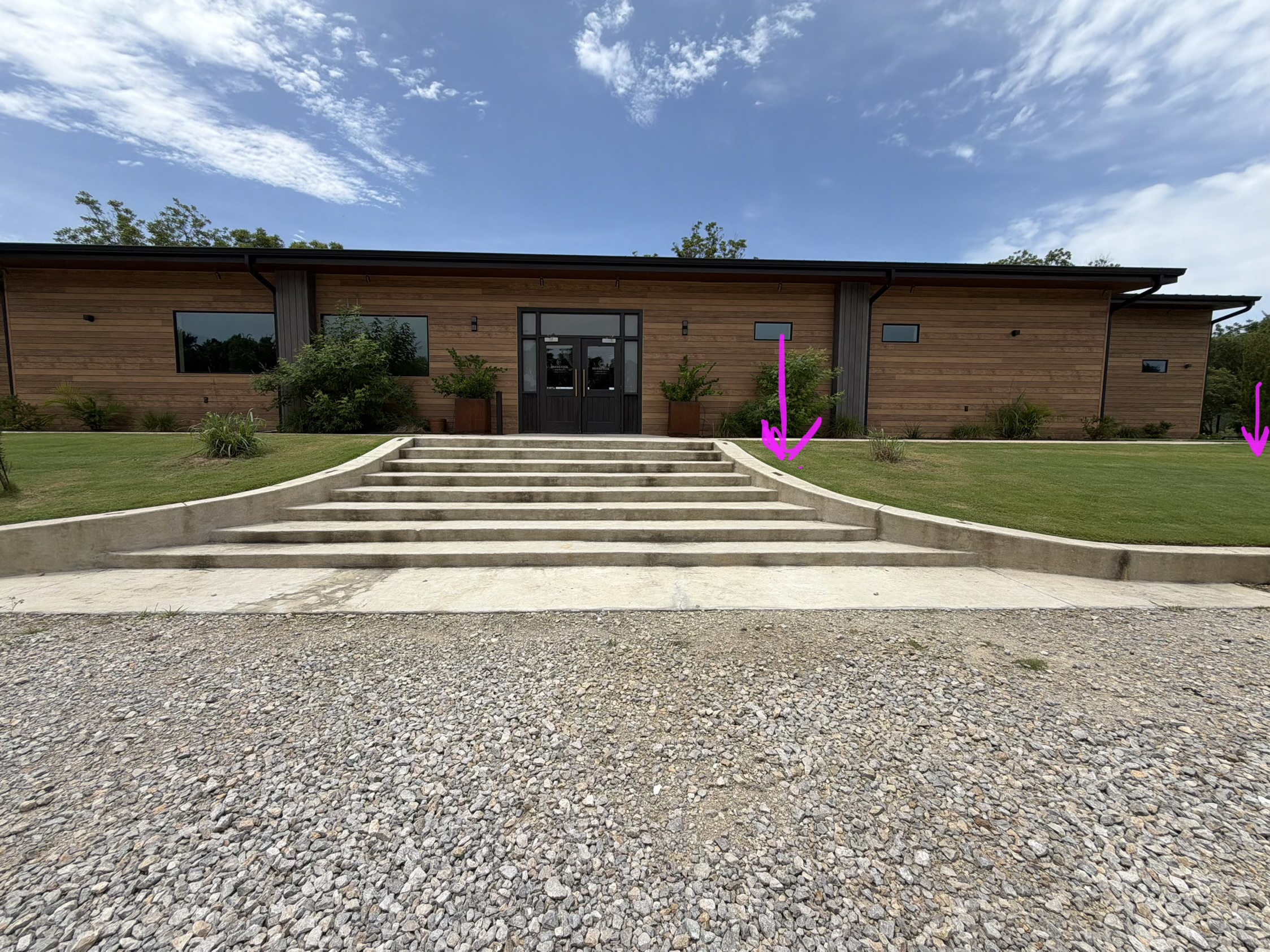 Venue entrance with arrows showing where to place the signs
